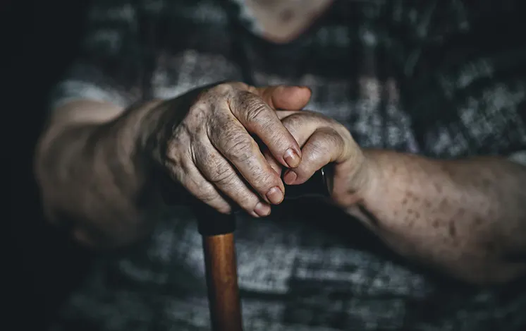 A old man hand with a crane